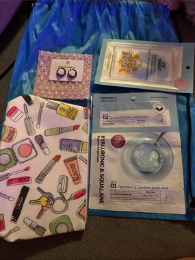 Clinique Makeup Print Pouch in White with Skincare Sheet Masks clinic bag